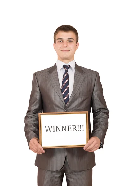 Счастливый молодой бизнесмен держит знак победителя — стоковое фото