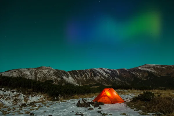 Polar Night landscape with illuminated tent and Polar Lights — Stock Photo, Image