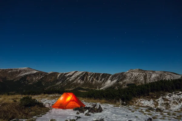 Night mountain landscape with illuminated tent — Stock Photo, Image