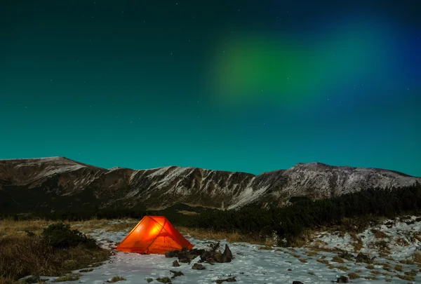 Polar Night landscape with illuminated tent and Polar Lights — Stock Photo, Image