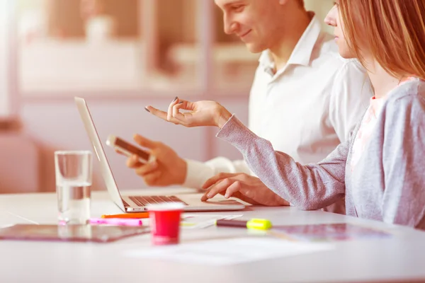 Man and Woman discussing Start Up Project pointing on Computer — Stock Photo, Image