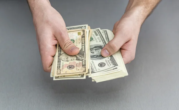 Counting large stack of cash notes — Stock Photo, Image