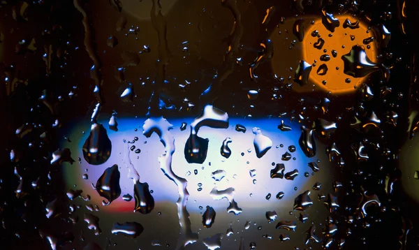 Gotas de lluvia y luces de neón — Foto de Stock