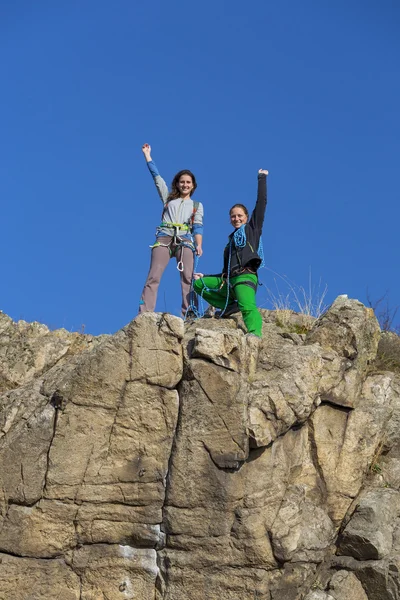 Group of two happy female climbers  celebrates the victory — Stock Photo, Image