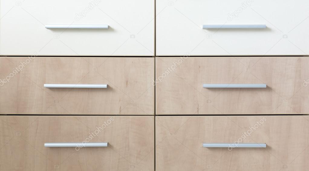 Cropped cabinet with six symmetric drawers