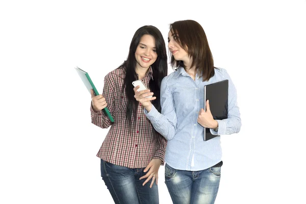 Two cute girls keeping large note pads — Stockfoto