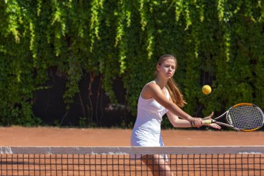 Female athlete returning ball