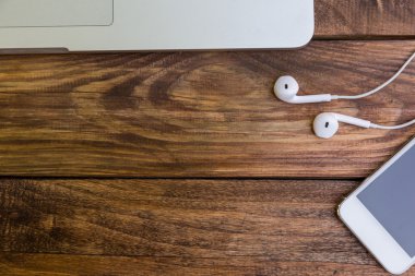 Essential items on wooden desk