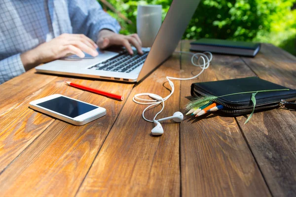 Textured wooden desk and hardworking man