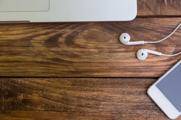 Essential items on wooden desk