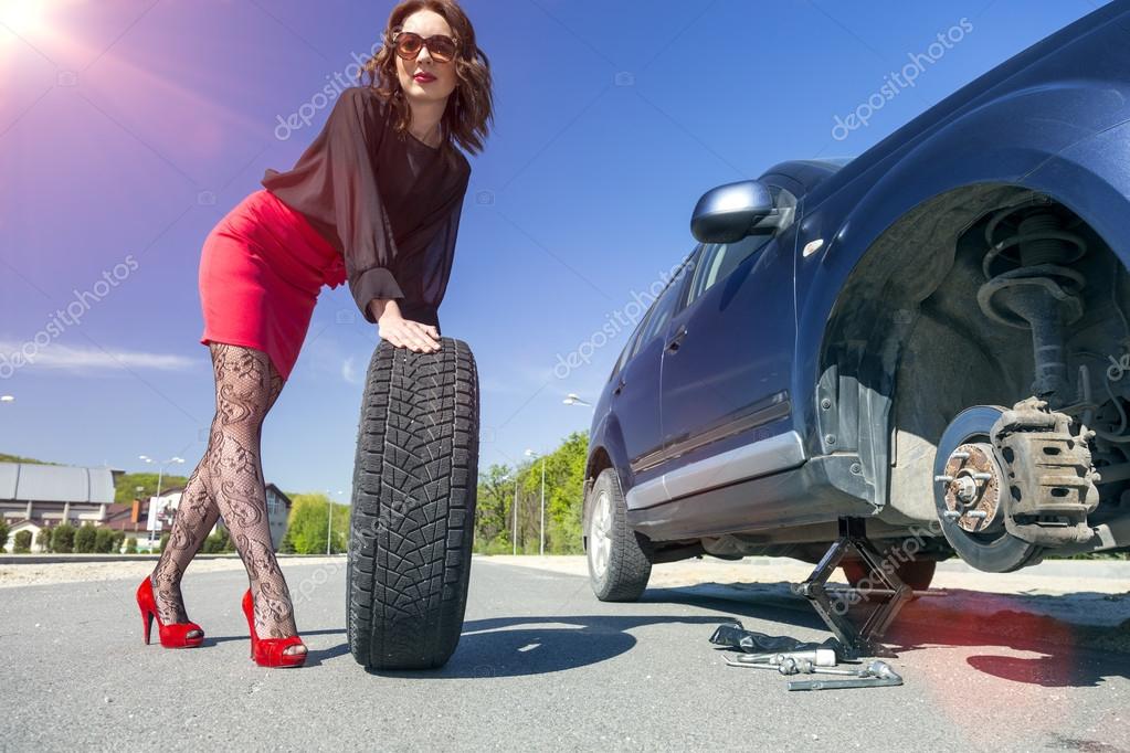 arrivé - Le BO nouveau est presque arrivé... - Page 20 Depositphotos_77522370-stock-photo-leggy-female-changing-wheel-of