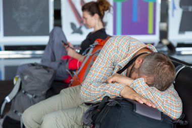 Passengers waiting for the air flight at airport terminal