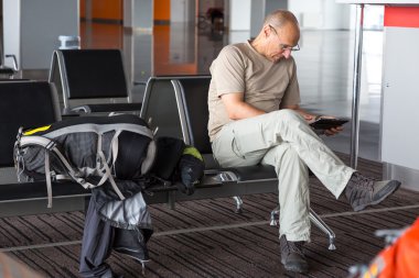 Aged passenger waiting for boarding