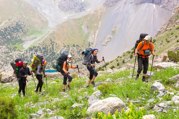 Group of three hikers on trail — Stok fotoğraf