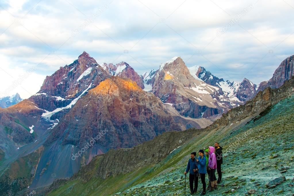 People observing mountain scenery