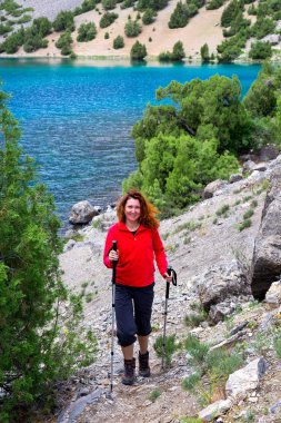 Female Hiker and Mountain Lake