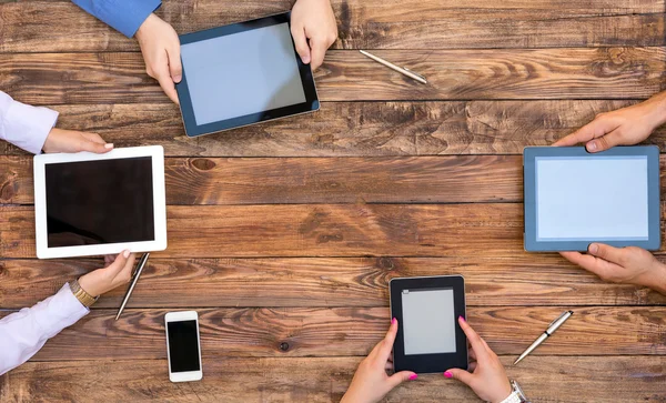 Male and Female Arms with Digital Gadgets — Stock Photo, Image