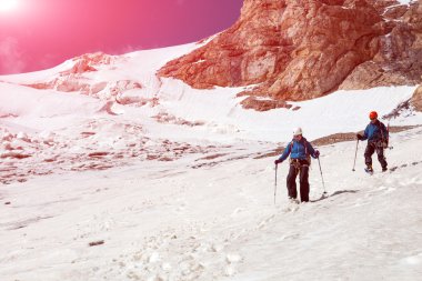 Climbing Partners Walking Down on Glacier