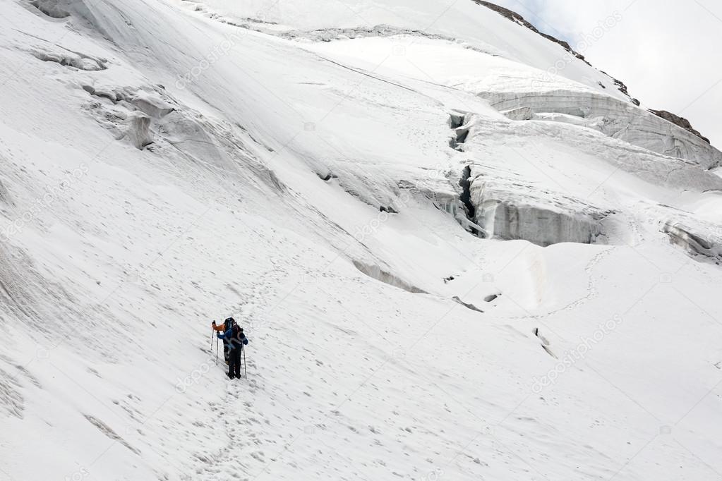 Alpine Partners Walking on Snow Trail