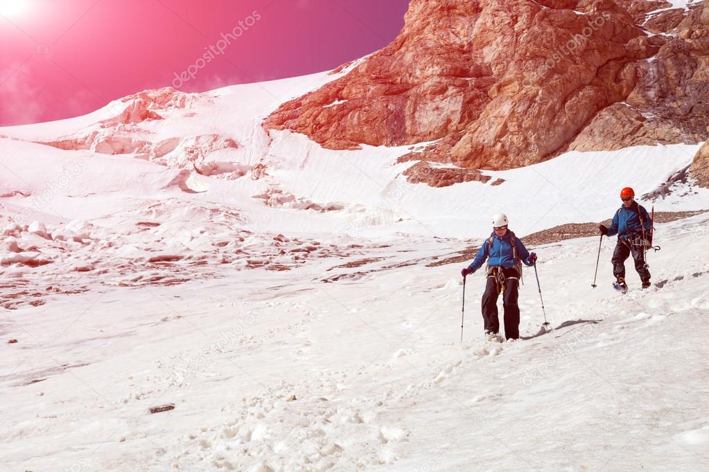 Climbing Partners Walking Down on Glacier