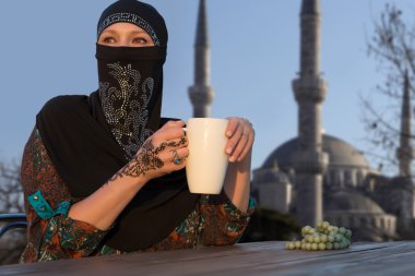 Middle Eastern Woman at Cafe Terrace clipart