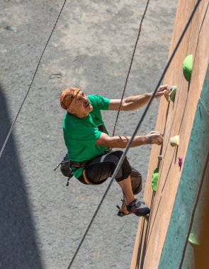 Mature Athlete in Head Band on Extreme Sport Training