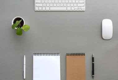 Grey Wooden Desk with Stationery and Electronics