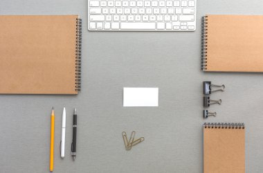 Grey Wooden Desk with Business Items in Calm Classic Colors