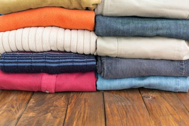 Jeans Pants and Classic Wool Sweaters on Wood