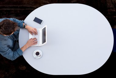 Businessman Working on Computer at Office Grey Round Table Top View