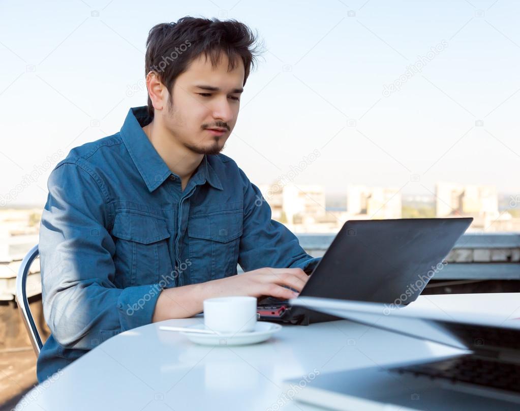 Young Asian Bearded Businessman Working on Computer
