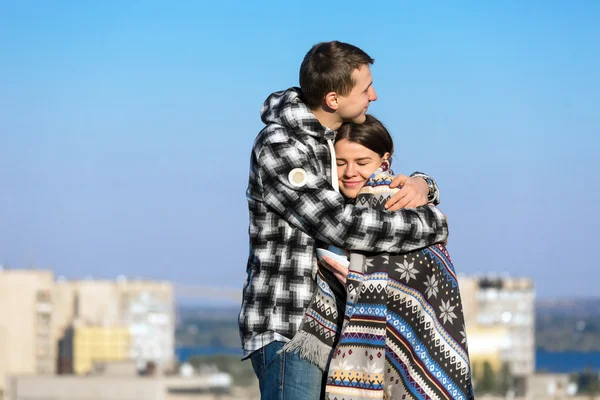 Young Couple Embracing Warming Plaid — Stockfoto