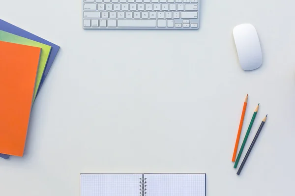 Creative Office Bright Table with Matching Color Magazines and Pencils Computer and Notepad — Stock Photo, Image