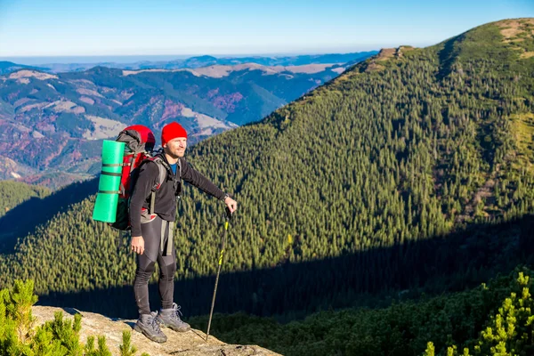 Hiker Staying on High Rock and Mountain View with Autumnal Forest — Stock Photo, Image