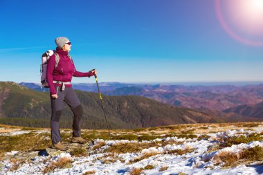 Female Hiker Staying on Mountain Trail and Enjoying Nature