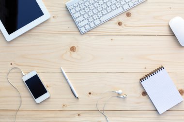 Light wooden Background and modern Business Items on Desk
