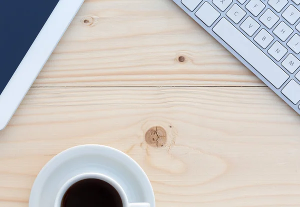 Top View of Wood Table with Cropped Electronics and Coffee Cup — 스톡 사진