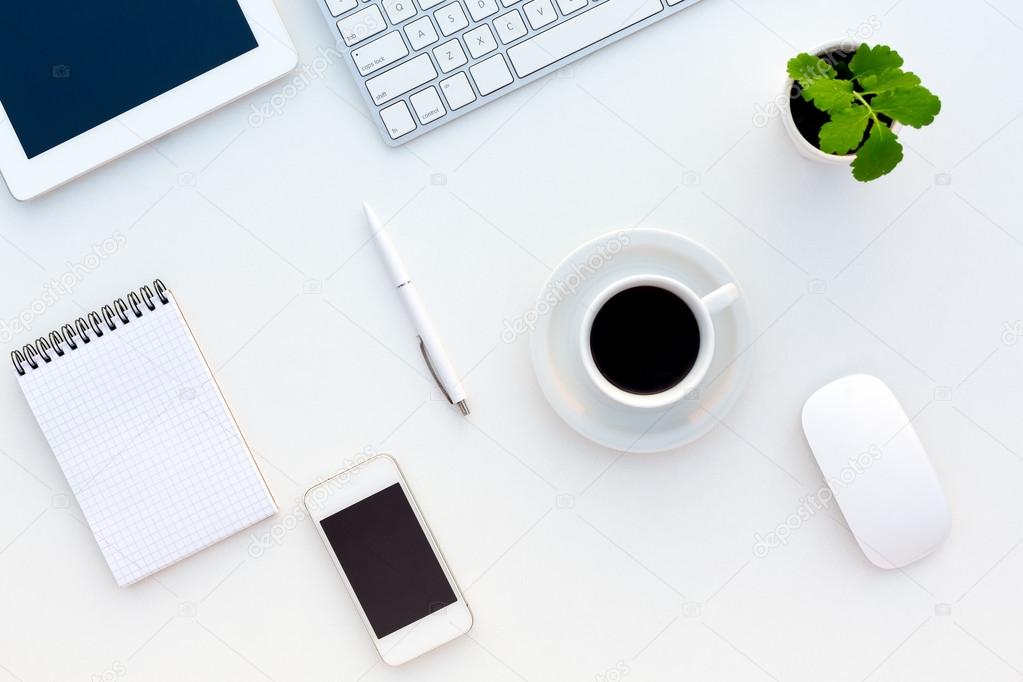 Top View of White Office Desk with Modern Electronics Stationery and