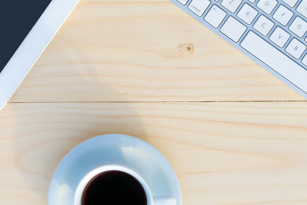 Light Wooden Desk Top View with Business and Every Day Life Items Electronics and Coffee Mug — Zdjęcie stockowe