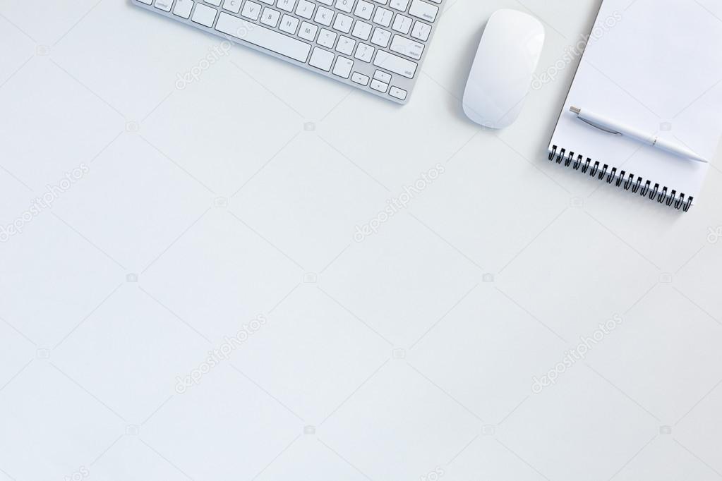 Business Background on white Table with Keyboard Mouse Notepad 