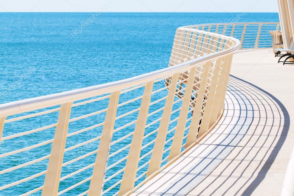 curved metal railing of Lido di Camaiore's pier