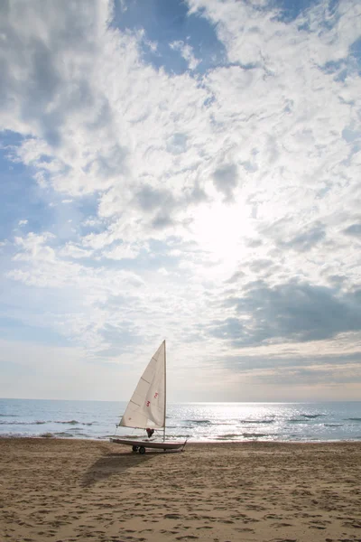 Small sailboat on a cart at the beach — Stock Photo, Image