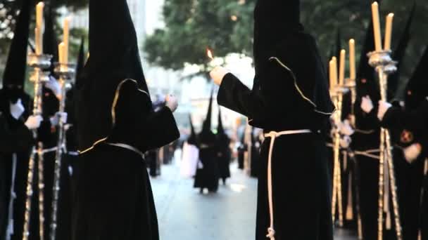 Hooded Nazarenos parade — Stockvideo