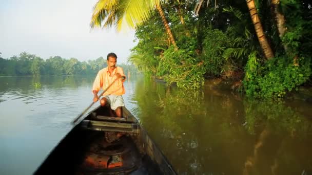 Canoeing by local people on backwaters — Stock Video