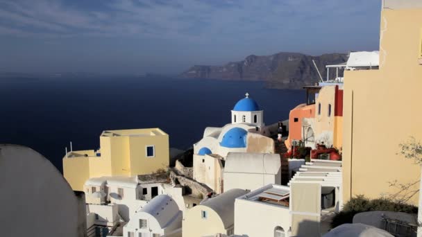 Domed white washed churches of Oia at Sunset Greece — Stock Video