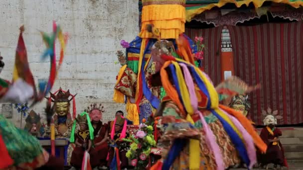 Masked dancers watching a dance festival — Stock Video