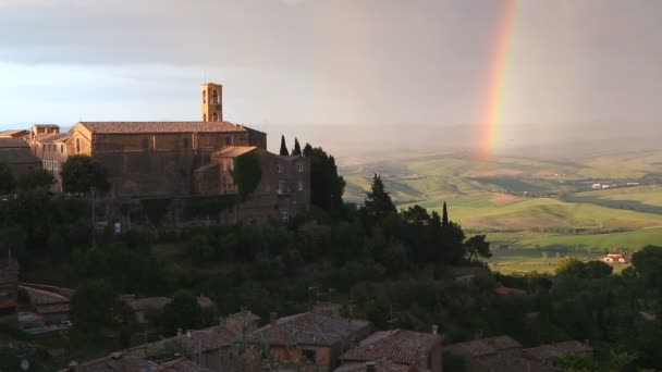 Rainbow above  hill town church — Stock Video