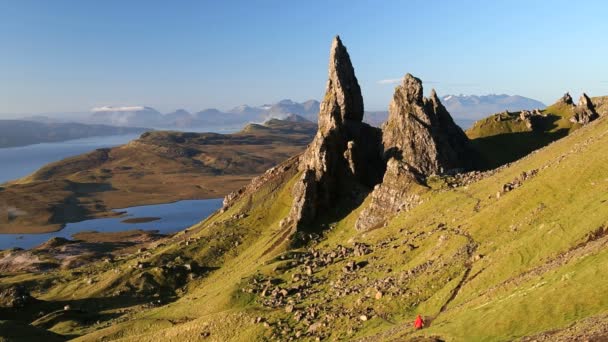 Lone walker on Old Man of Storr — Stock Video