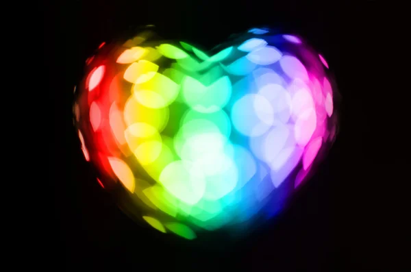 Arcobaleno cuore bokeh su sfondo nero — Foto Stock