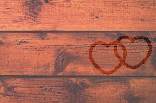 Fondo de madera con formas de dos corazones amorosos . —  Fotos de Stock